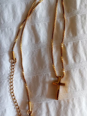 Steel small cross new in gold color