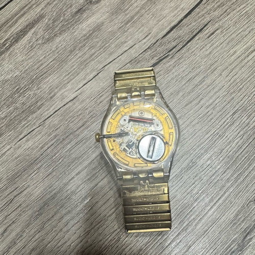 Swatch Dazzling Light χρυσαφί μπρασελέ από ανοξείδωτο ατσάλι μεταχειρισμένο σε καλή κατάσταση