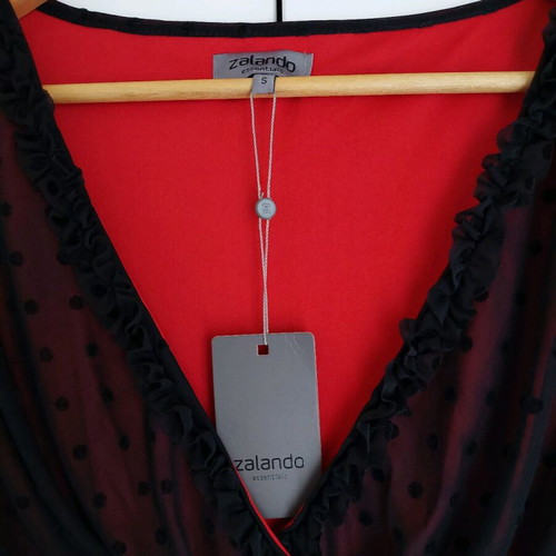 Women's evening dress new, black with red lining and satin belt