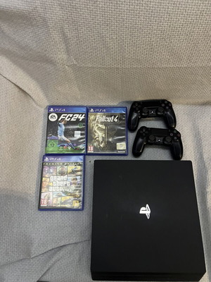 PlayStation 4 Pro 1TB console with 2 Sony controllers and 3 games
