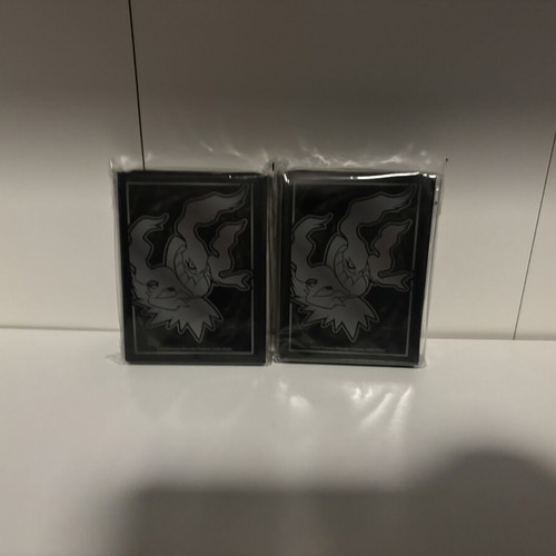 Pokemon card sleeves, 11 packs from different sets