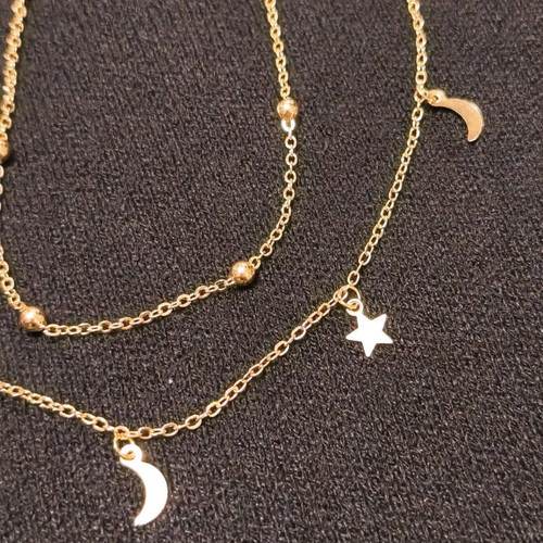 Double necklace in gold color like new with stars and crescent moons