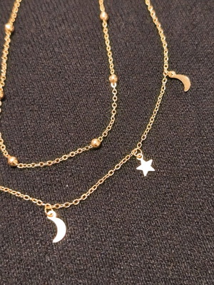 Double necklace in gold color like new with stars and crescent moons