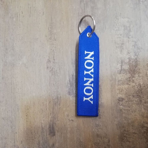 Nounou keychain new, blue with white letters