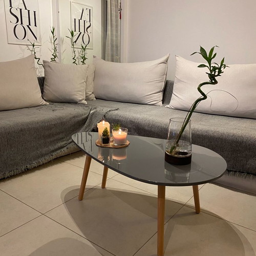 Coffee table new gray with glossy lacquer surface and solid legs