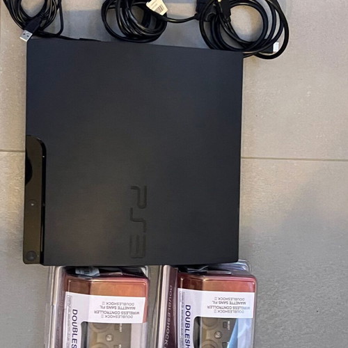 PlayStation 3 Slim 320GB console like new with 2 OEM controllers