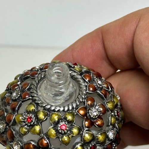 Vintage glass perfume bottle with floral enamel decoration
