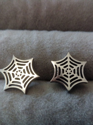 Spider web stud earrings pair new, silver steel