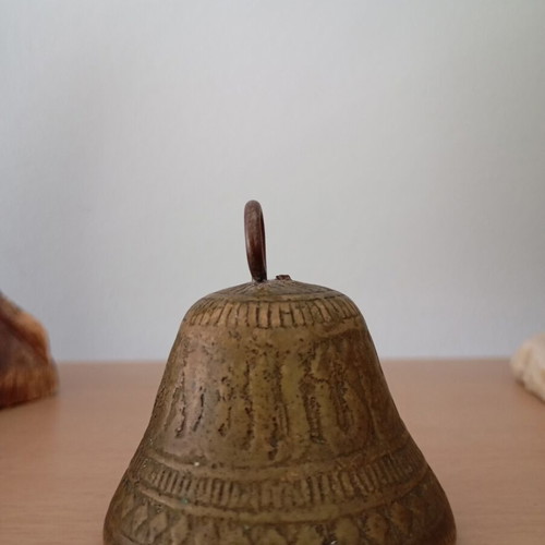 Vintage brass bell with embossed geometric designs like new