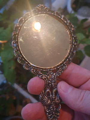 Vintage hand mirror used, silver plated from the 60s