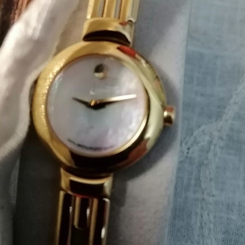 Movado women's watch like new with bracelet and sapphire crystal