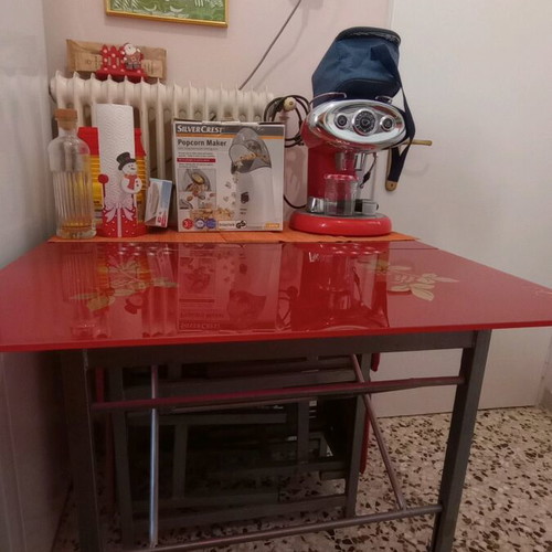 Folding table with 4 stools used, red color