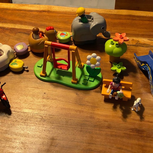 Playmobil playground set with train and motorcyclist like new