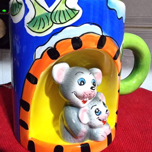 Decorative ceramic mugs set of 2 with embossed animal designs like new