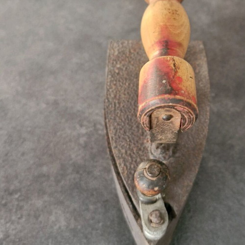 Vintage coal iron used with wooden handle and patina