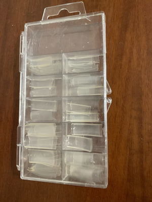 Plastic nail tips like new with some almond-shaped