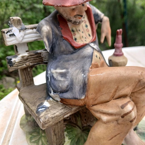 Traveler figurine used, missing one hand