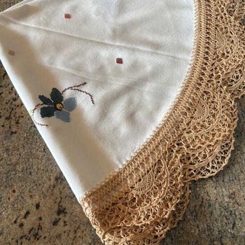 Round doily or small woven tablecloth with handmade edging like new