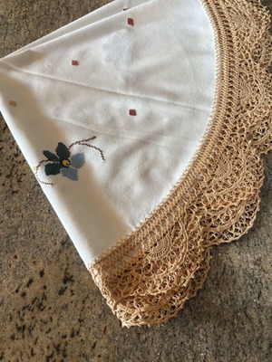 Round doily or small woven tablecloth with handmade edging like new