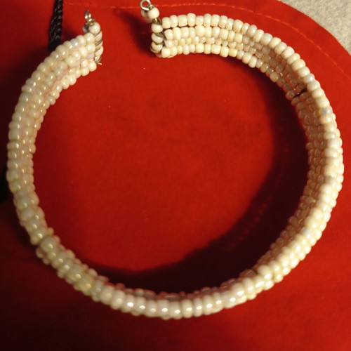 Vintage bracelet used with multiple rows of tiny white beads