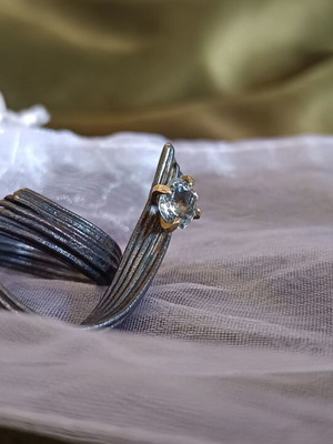 Handmade ring of oxidized silver with white topaz like new