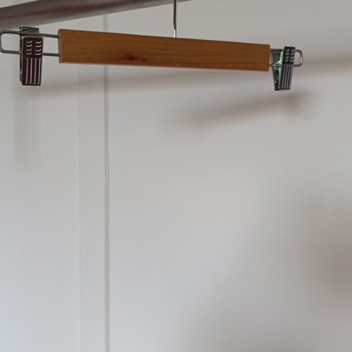 Wooden hanger with metal clips like new