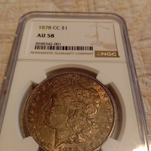 Morgan Dollar 1878 cc like new, certified by NGC AU 58