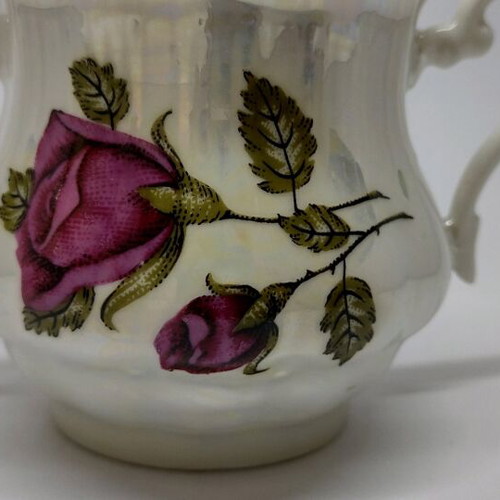Porcelain sugar bowl with roses and gold trim like new