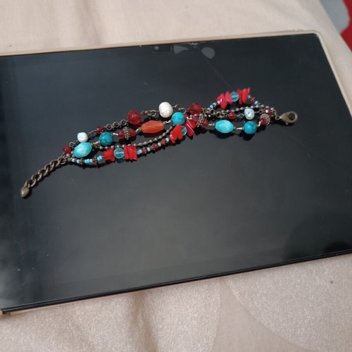 Women's bracelet with turquoise and red stones used
