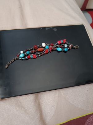 Women's bracelet with turquoise and red stones used