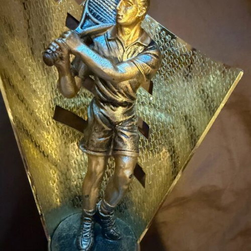 Award trophy used with tennis player figure for padel tournaments