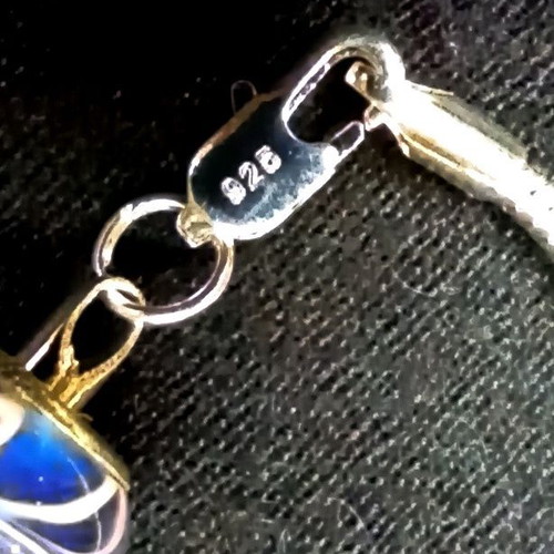Silver 925 bracelet like new with 4 charms, 20 cm length