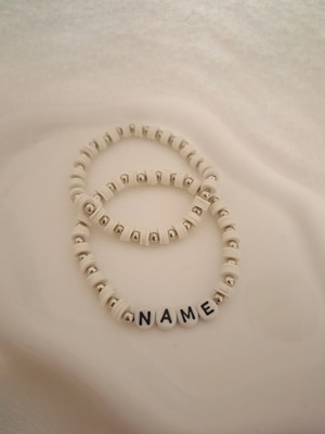 Handmade name bracelet with white clay beads