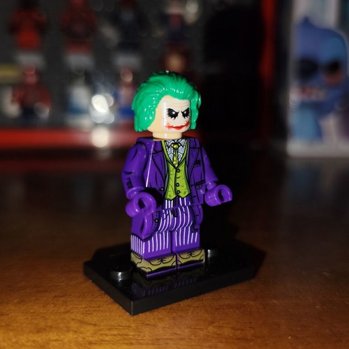 Joker Dark Knight Trilogy minifigure like new with base and two heads