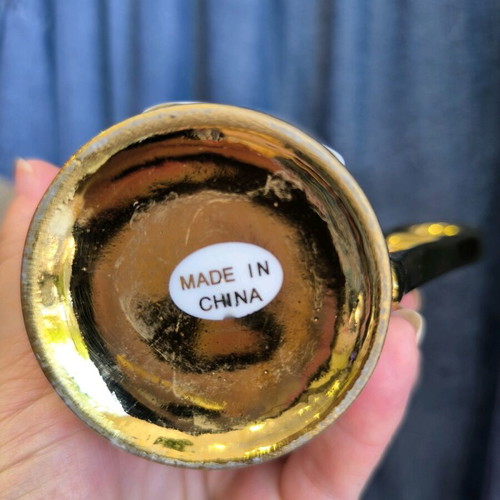 porcelain mug with gold inscriptions