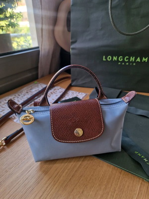 Longchamp Le Pliage Mini τσαντάκι χειρός σαν καινούργιο, τιρκουάζ με καφέ δέρμα