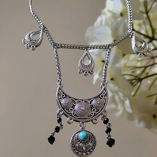 Steel boho necklace like new with turquoise stone and black beads