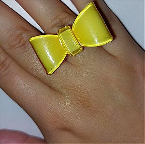 Κίτρινος φιόγκος δαχτυλίδι