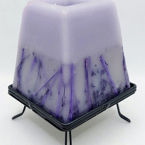 Decorative purple lavender candle with metal base