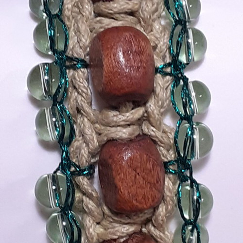 Handmade bracelet with brown wooden beads and light green glass