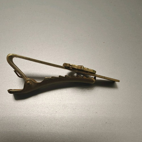 Collectible tie clip used, gold color with French security emblem