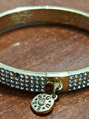 Guess women's bracelet, gold plated with missing stones