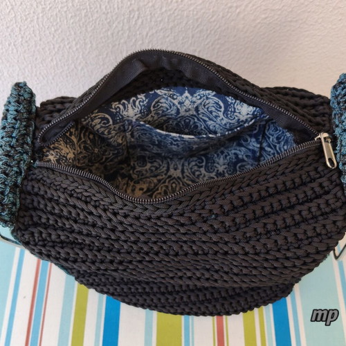 Handmade knitted bag with metal handles and inner lining