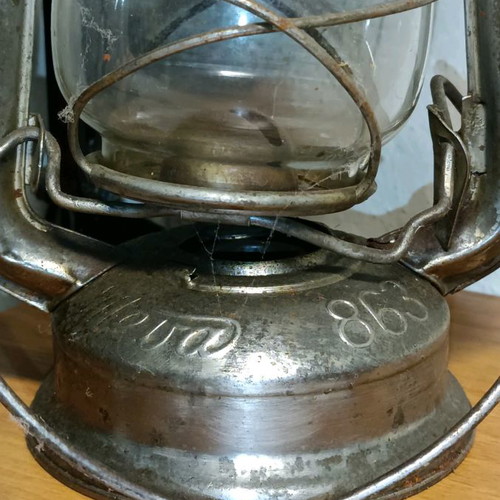 Vintage storm lantern used with cracked glass