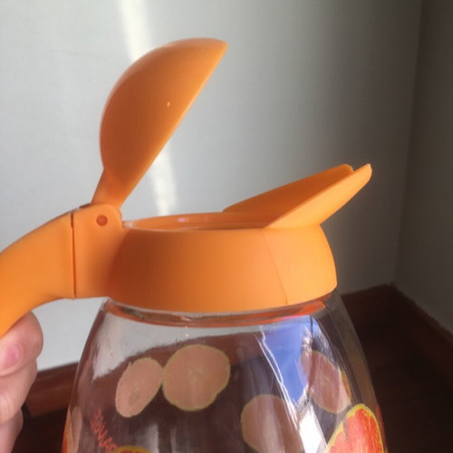 Solmazer jug like new with orange pattern and plastic lid