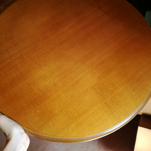 Wooden round coffee table used with carved base