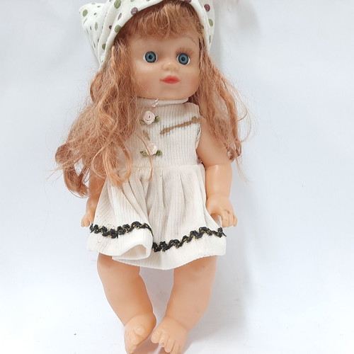Vintage plastic doll 60s with open eyes, white knitted dress, tiara