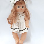 Vintage plastic doll 60s with open eyes, white knitted dress, tiara