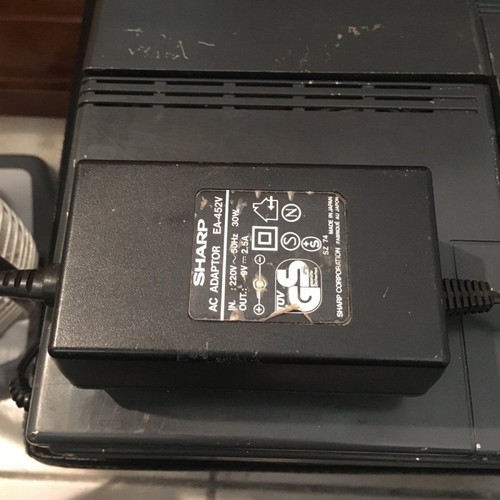 Sharp PC-4500 laptop collectible with charger