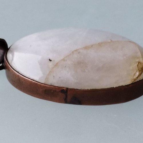 Metal necklace with oval moonstone semi-precious stone used